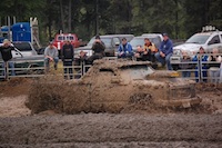 A truck completely covered in mud.