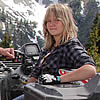 people sitting on ATVs at a mountain location