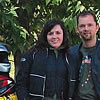 people standing beside their motorcycles