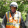 man riding an ATV on a narrow bridge