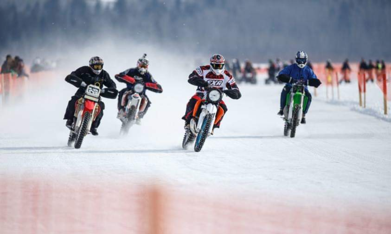 Four motorbikers ride over ice during the Numb Bum Ice Race. 