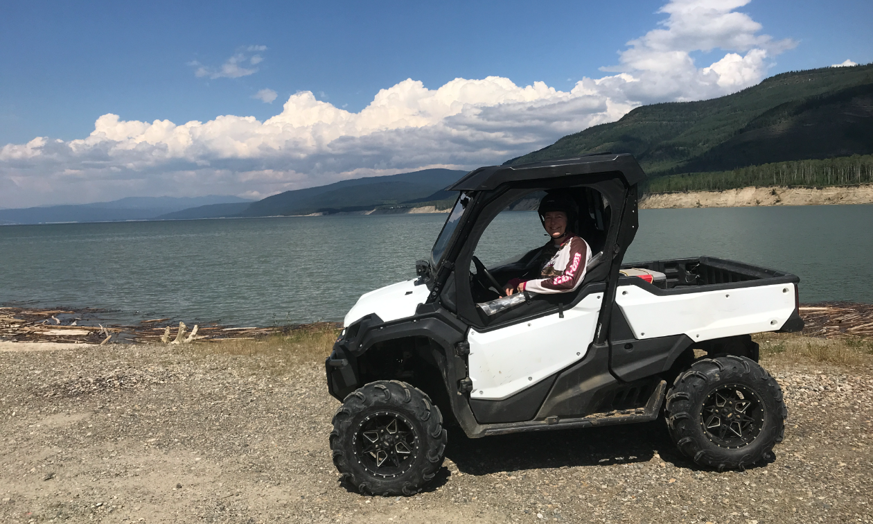 Lisette Vienneau parks her side-by-side ORV next to Dinosaur Lake. 