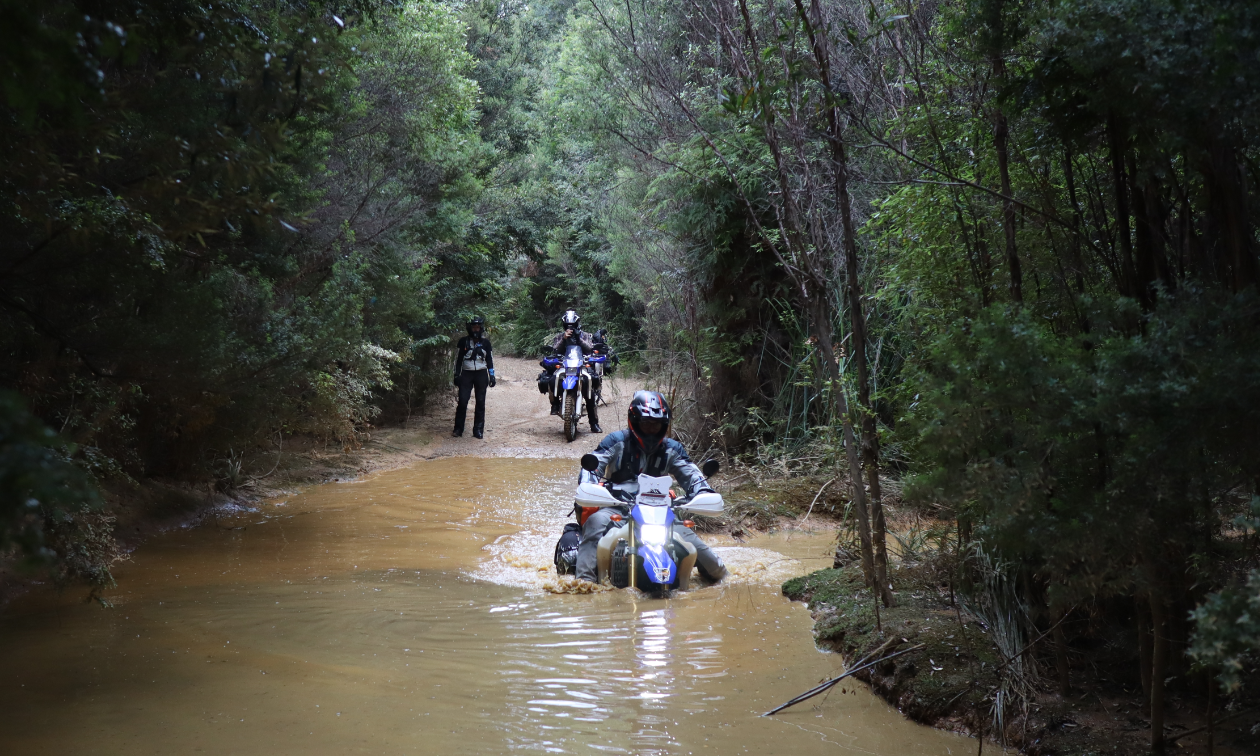 Kevin Chow crosses a deep ravine on his 2015 Yamaha WR250R.