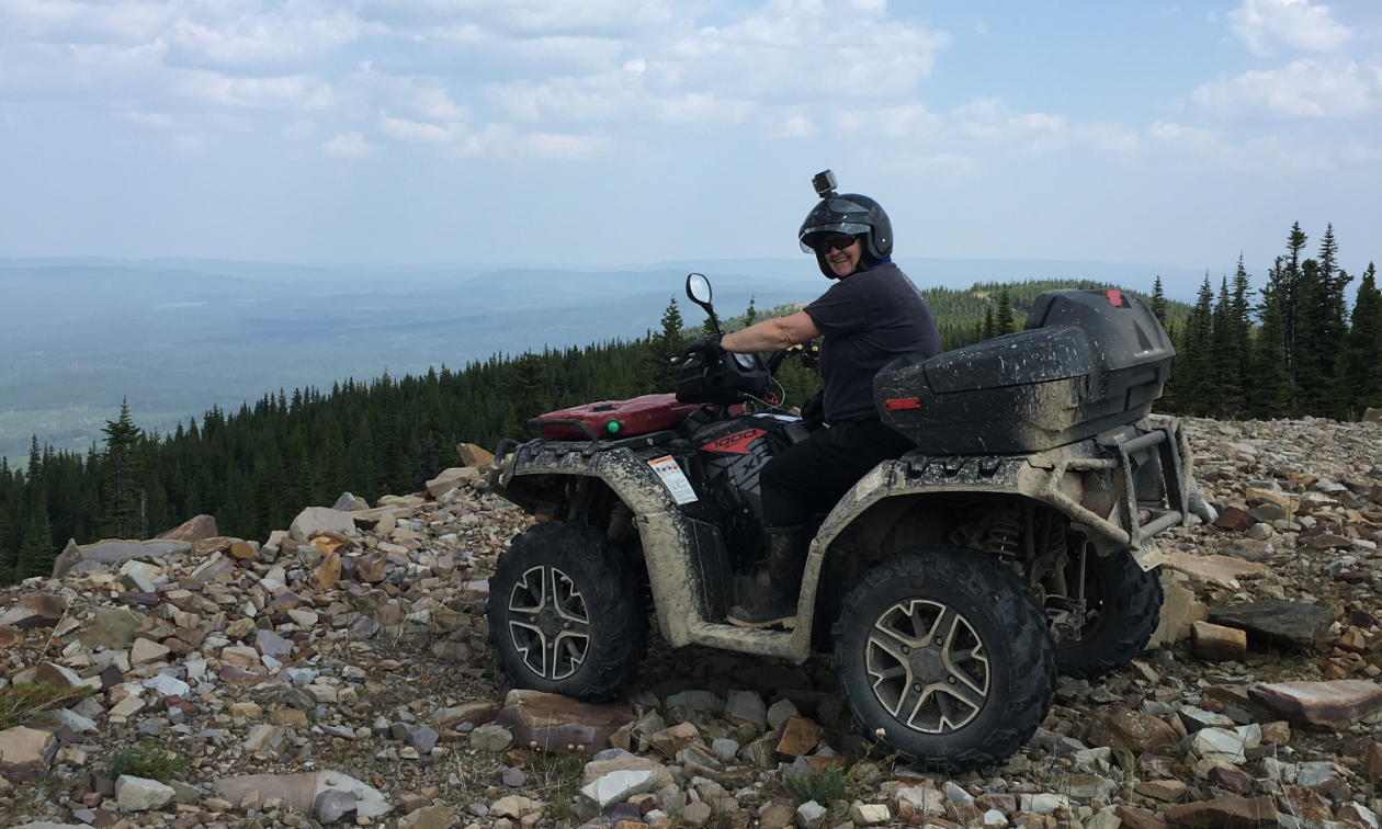 Nycole Ross rides a Polaris Sportsman 1000 quad on top of Tabor Mountain.