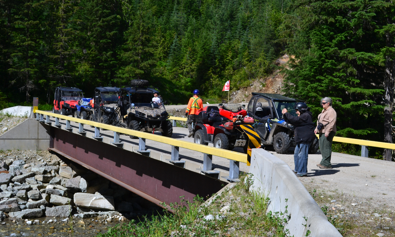 ATVers gather and take a break on a bridge. 