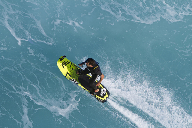 An overhead view of a man riding a JetSurf board