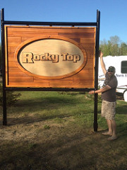 Kevin Butler in front of the new Rocky Top ATV Park Entrance sign