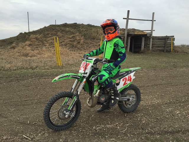Logan Stuart on No 24 green bike and matching green outfit.
