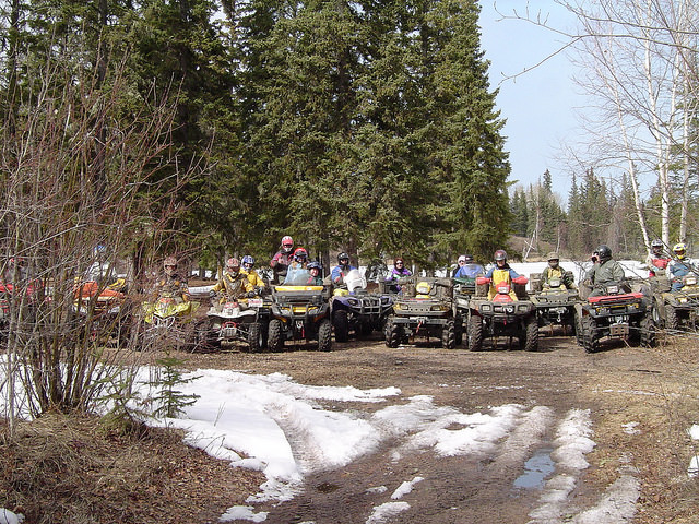 A group of friends ATVing in the Cold Lake area.