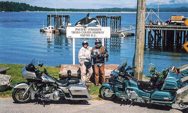 Gina and Les Tottle standing by their bikes in the bay at Tofino, B.C. 