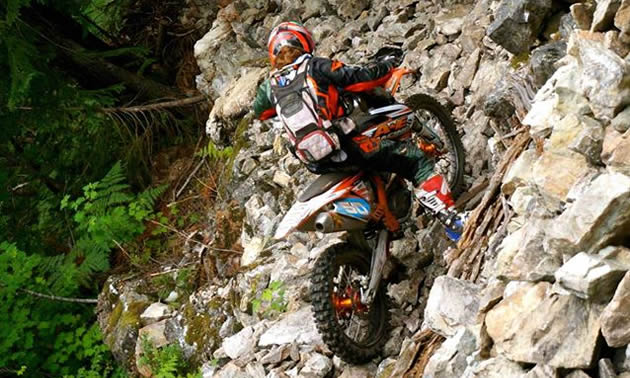 Shelby Turner tackles a tough section of trail on her motorcycle. 