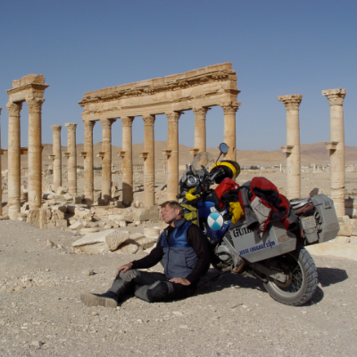 Glen Heggstad rests in the Roman ruins at Palmyra, Syria