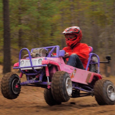 Ethan Schlussler rides a Power Wheels Barbie Jeep off-road go kart with a CRF 450 dirt bike engine.