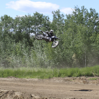 A motorcycle rider takes to the air in High Level