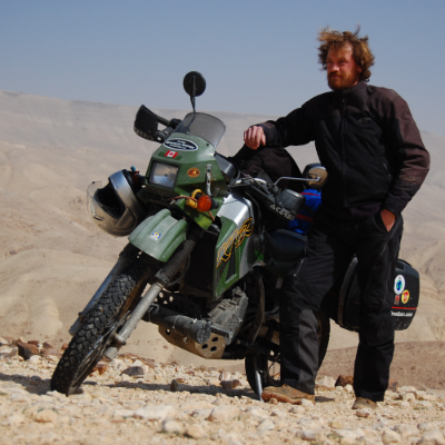 Jeremy Kroeker is an author and world traveller (here, near the Dead Sea).