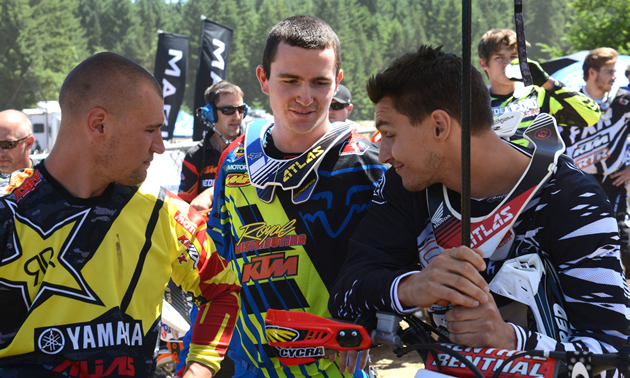 Bobby Kiniry, Cole Thompson and Colton Facciotti talking in the pits. 