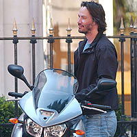 Keanu Reeves and Gard Hollinger beside the new KRGT-1 motorcycle. 