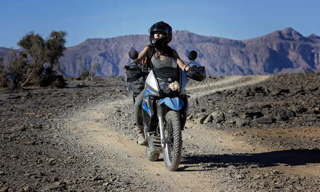 Rosie Gabrielle motorcycling in Africa. 