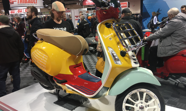 2020 Vespa Sean Wotherspoon Special Edition scooter is mostly yellow with red and turquoise colour scheme. 