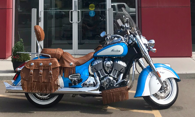A baby blue Indian motorcycle.