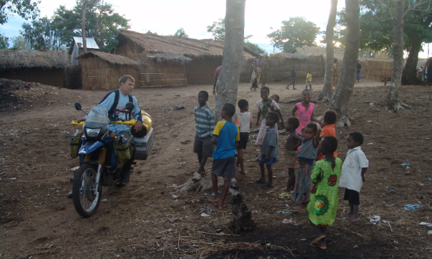 Glen Heggstad gave local youngsters motorcycle rides upon arrival at a Malawi village.