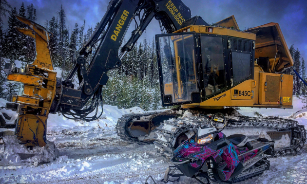 Hannah Dehoog operates a Tigercat LX870C for logging and commutes to work via her 2015 Polaris 800 Assault with GGB exhaust.