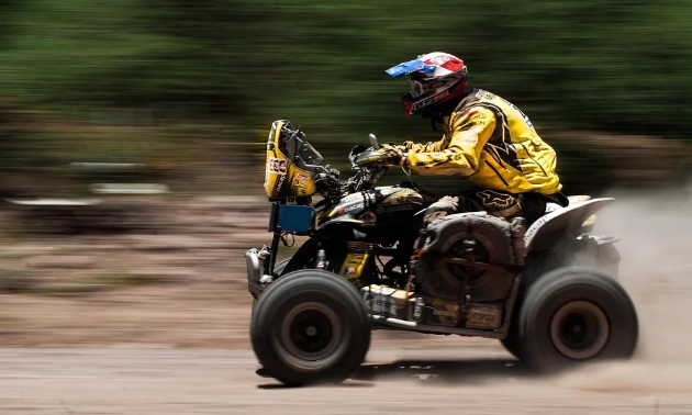 An ATVer becomes a blur as he races his quad.