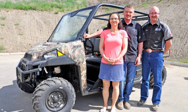 (L to R) Tracy and Heino Seibert, owners of Spectra Power Sports, and Scott Fraser, general manager of Spectra Power Sports.