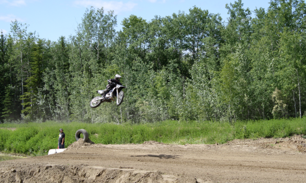A rider takes to the air after a big jump.