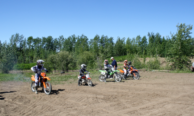 Motocross racers line up for a race
