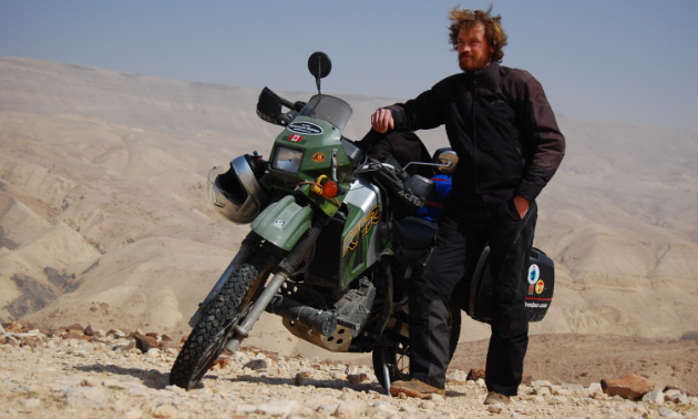 Jeremy Kroeker is an author and world traveller (here, near the Dead Sea).