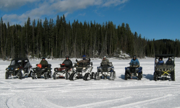 ATV riders line up to pose for a picture