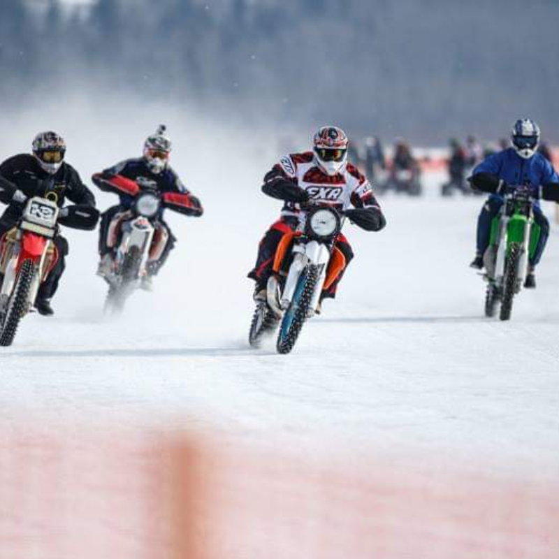 Four motorbikers ride over ice during the Numb Bum Ice Race. 