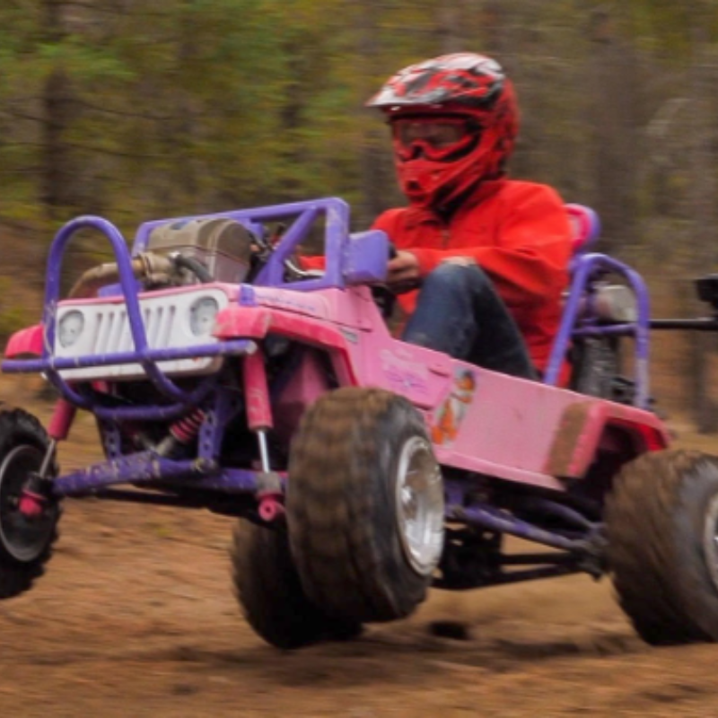 Ethan Schlussler rides a Power Wheels Barbie Jeep off-road go kart with a CRF 450 dirt bike engine.