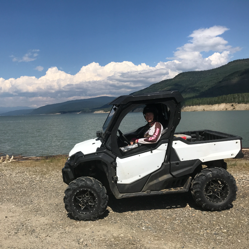 Lisette Vienneau parks her side-by-side ORV next to Dinosaur Lake. 