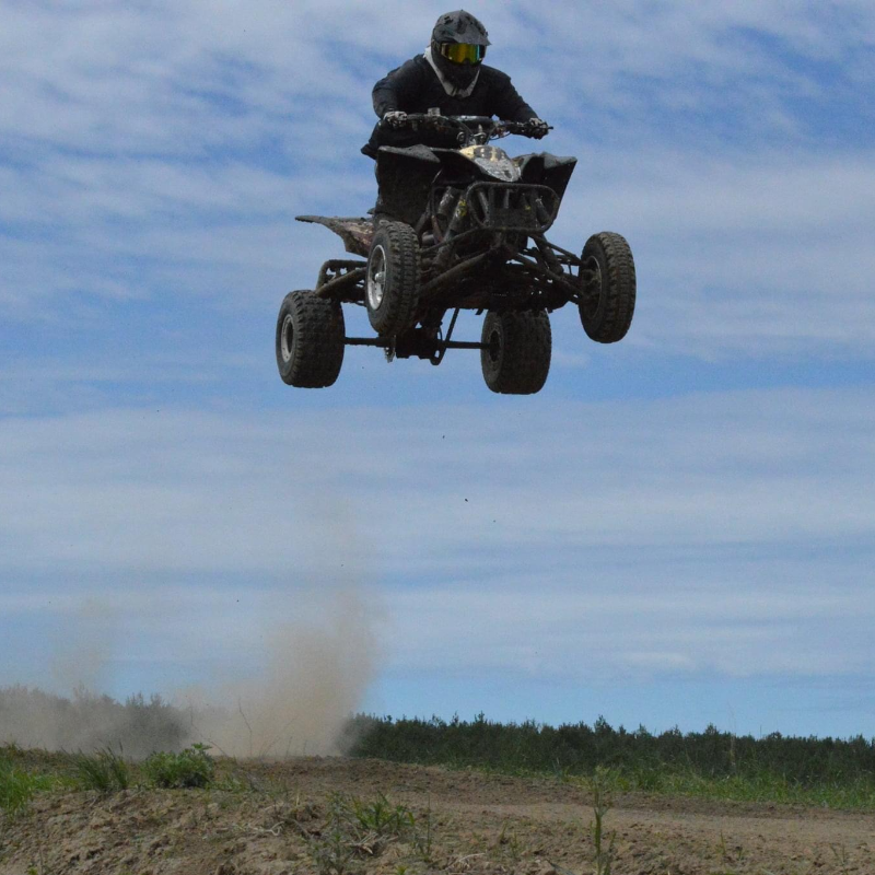 Jason Stapleton gets massive air on his ATV as he lifts off into the blue sky. 