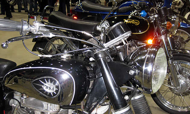Vintage motorcycles at a show. 