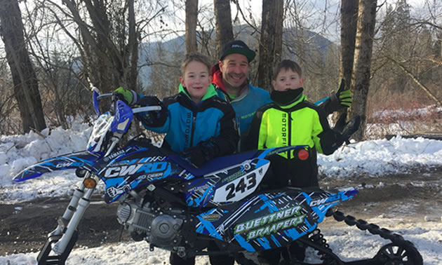 Advanced sled racer Jared Buettner (middle) and sons Korbin (left, age six) and Kohen (right, age five) also known as Little Ripper snowmobile racers.