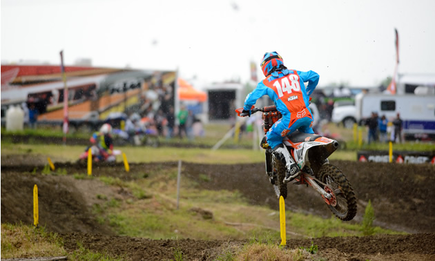 Cole Thompson charging down a motocross track. 