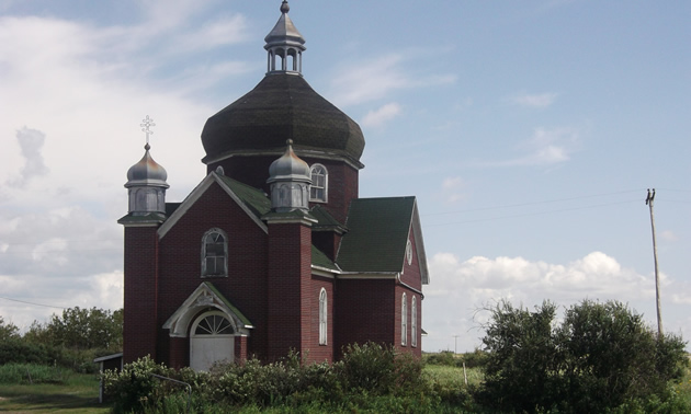 A beautiful old church on the side of the road. 