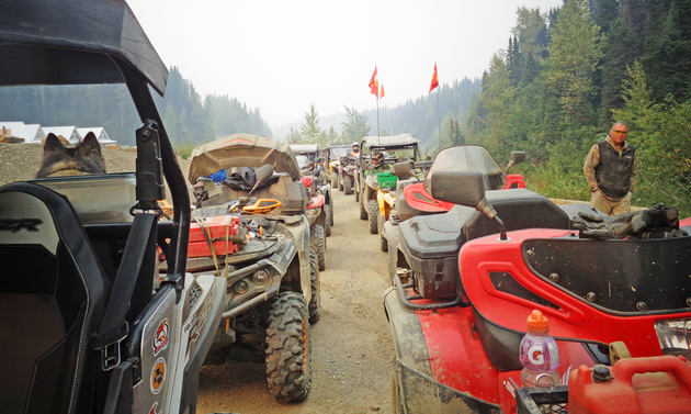 A long line of quads are ready to start a sunset ride.