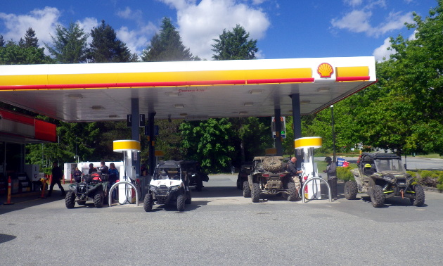 ATVs fill up at a Shell gas station. 