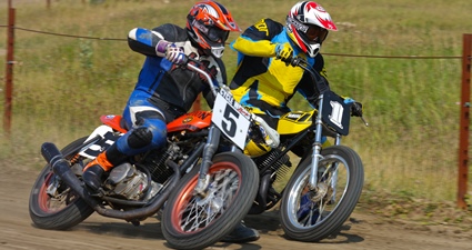 Photo of a person racing on a dirtbike