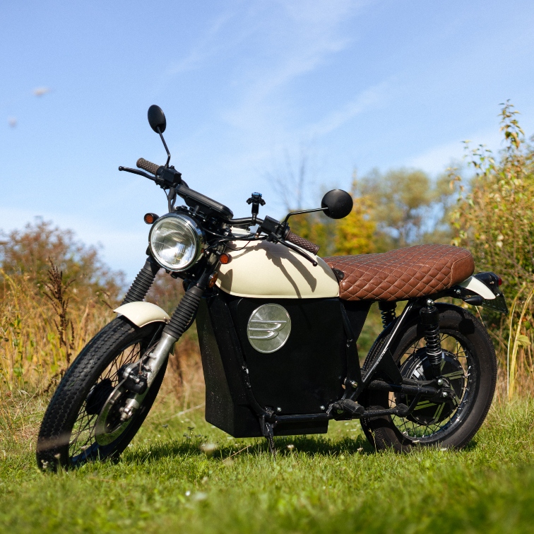 man sitting on a Beachman bike with a helmet on