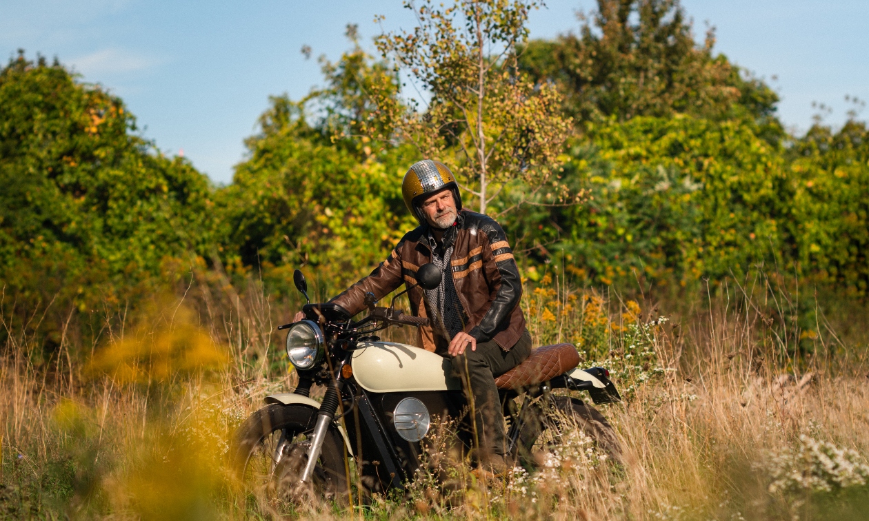 man sitting on a Beachman bike with a helmet on