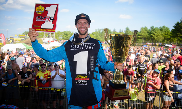 Kaven Benoit holds up his No. 1 plate in front of fans at round 10 of nationals. 