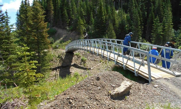 A 90-foot bridge in the South Kootenay pass was installed by members of the Crowsnest Pass Quad Squad. 