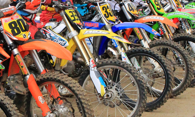 A row of colourful motorbikes. 