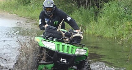 Tyler Manderscheid ATVing through mud