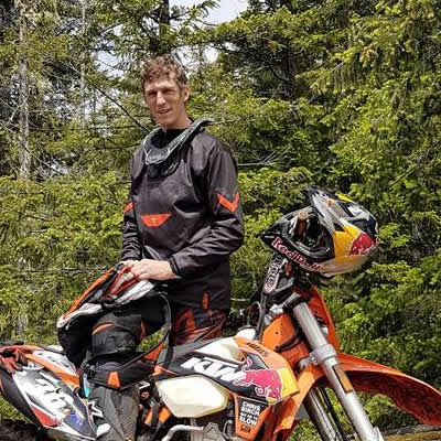 Chris Birch poses in Canada with his KTM 350 EXC. 